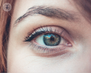 Close up image of a girl with green eyes