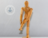 A wooden figure of a human posing