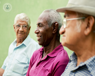 Men chatting in a group. 