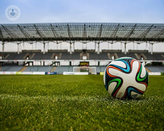 A football ball in a football pitch