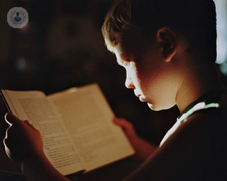A boy who has dyslexia reading