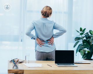 A woman suffering from low back pain