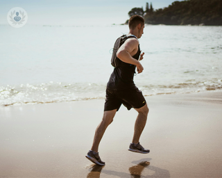 Man running on the beach.