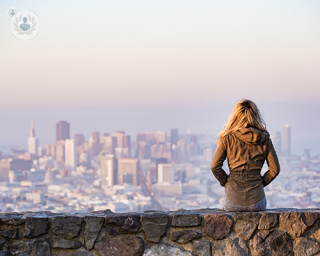A woman overlooking city views