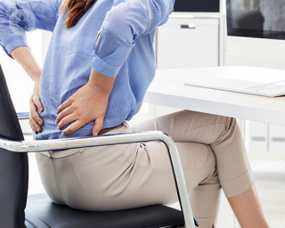 Woman suffering from back pain