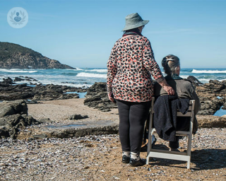 Two older women enjoying the beach together