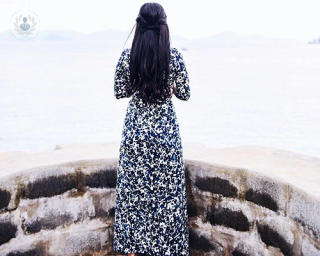 A woman looking out over the sea 