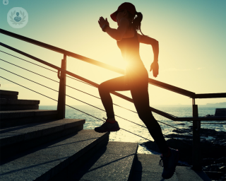 Woman doing exercise, which can reduce risk of cardiovascular diseases