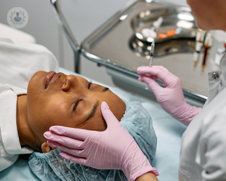 A woman in a facial aesthetics consultation, prepared to be given a polynucleotide injection