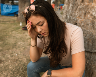 Woman experiencing mental symptoms of a thyroid disorder.