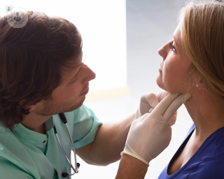 Doctor looking at a patient's thyroid gland