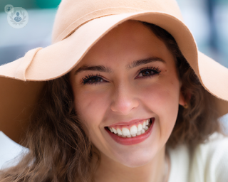 Woman smiling after tooth restoration