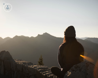 Woman looking at mountain thinking about adrenal gland disorders