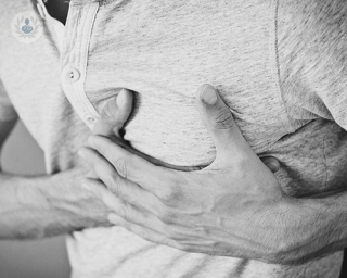 Man with chest pain, which can be a symptom of slipped rib syndrome.