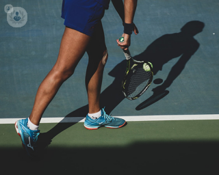 Someone playing tennis after a successful knee replacement 