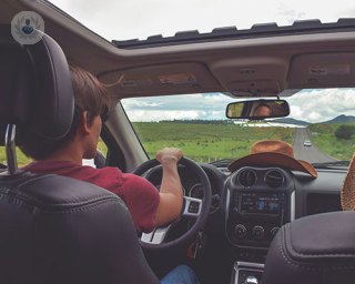 a man in car prone to cough