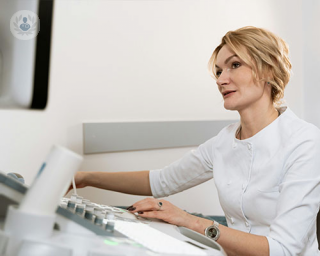 A doctor conducts a gynaecological scan