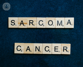 Letter blocks spelling out the words 'sarcoma cancer'