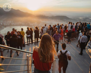 Woman looking at the sunset, thinking about vaginal prolapse