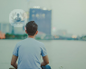 A man sitting looking at the city