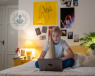 teenage girl in bedroom on a laptop
