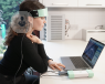 A girl with sensors attached to her head, undergoing a neurofeedback session.