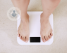 Two feet standing on a digital weight scale. Gastric sleeve surgery results in rapid weight change.