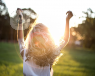 A woman dancing in the sun.