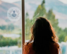 A woman looking out the window