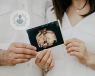 An image of a couple holding a ultrasound scan