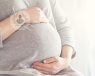 Pregnant woman thinking about noninvasive prenatal testing (NIPT).