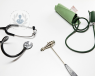 Tools used in a neurological examination, including a reflex hammer and a stethoscope.