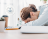 burnt out woman at desk