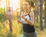 Girl jogging with earphones.