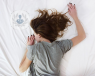 girl lying on a bed face down