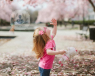 Child among cherry blossoms 