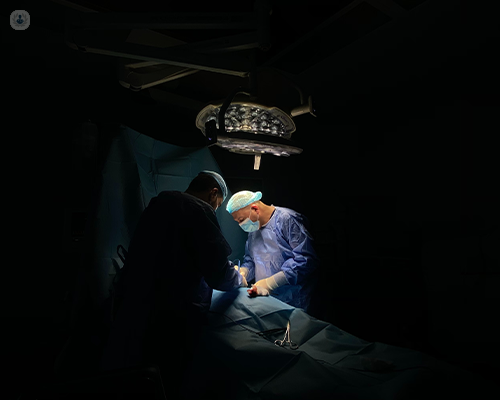 Surgeons performing a sphincteroplasty which is a type of obstructed defecation syndrome