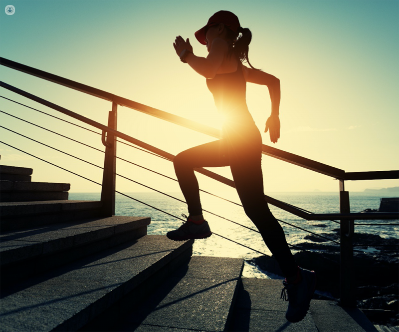 Woman doing exercise, which can reduce risk of cardiovascular disease.