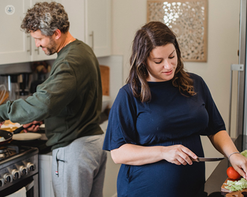 Couple cooking a healthy meal, part of weight management