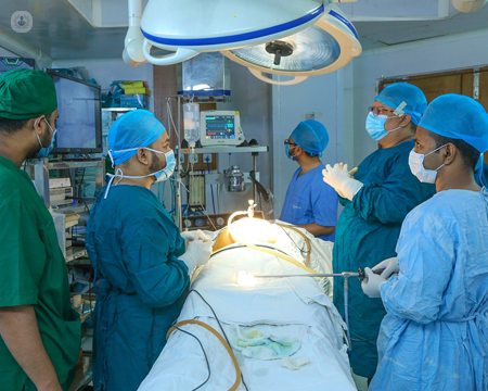 Colorectal surgeons performing a colectomy