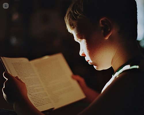 Boy with dyslexia reading