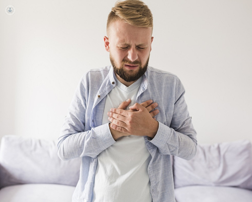 Man with chest pain, which is a sign of heart failure.