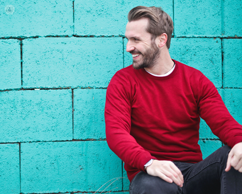 Smiling man who has had Invisalign treatment