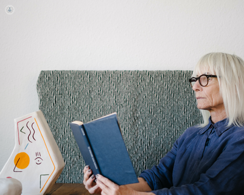 Woman with glasses considering different IOF lens options.